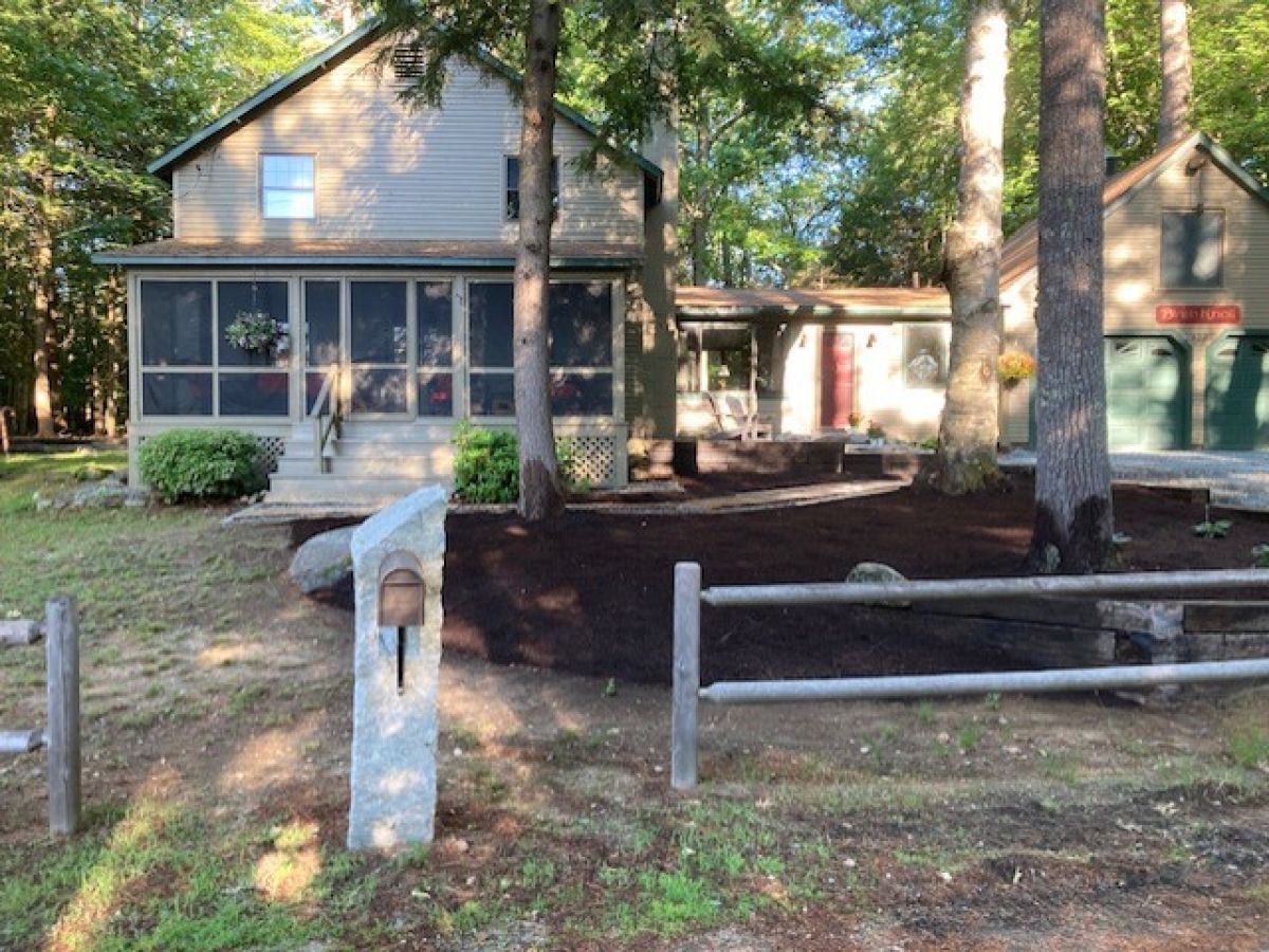 A peaceful woodland retreat with rustic charm, featuring a screened porch and tree-shaded grounds perfect for nature lovers seeking tranquility.