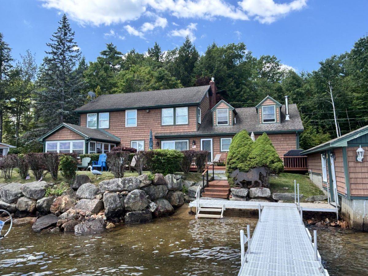 A lakefront property features a private dock with direct water access
