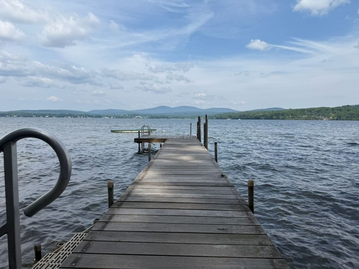 Private dock extending into pristine lake waters