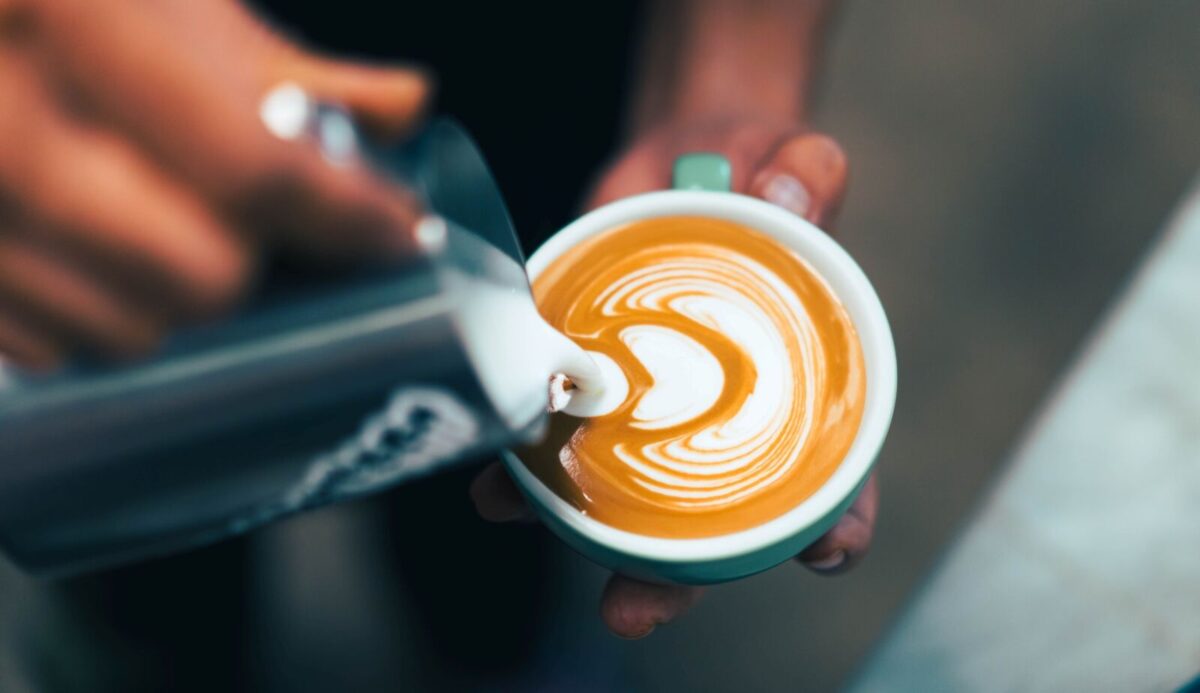 Barista pouring latte art.